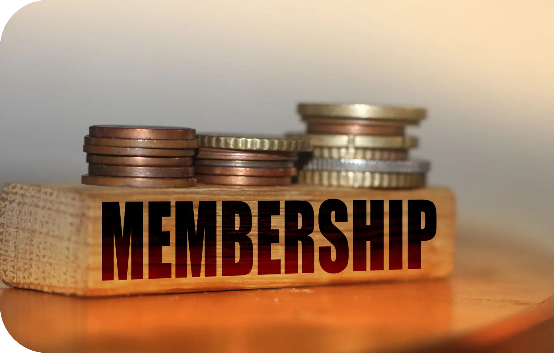 Stacked coins with the word 'MEMBERSHIP' underneath.